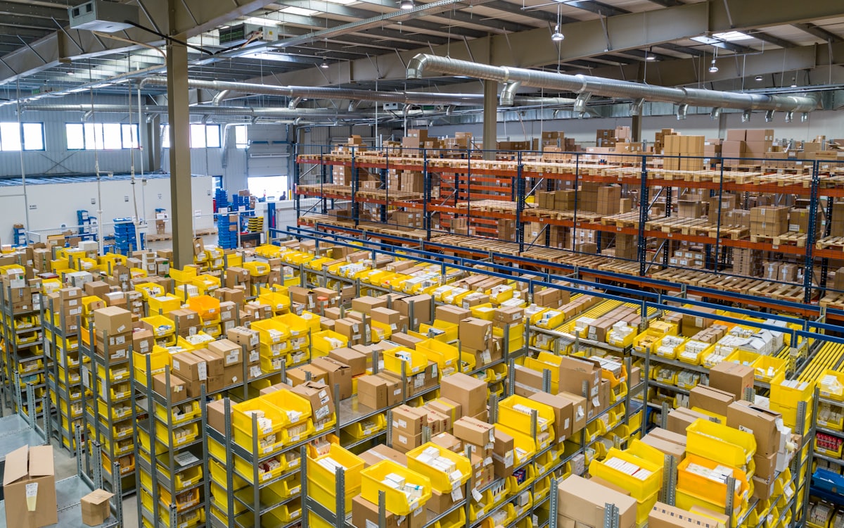 Warehouse aisles stacked with palletised freight